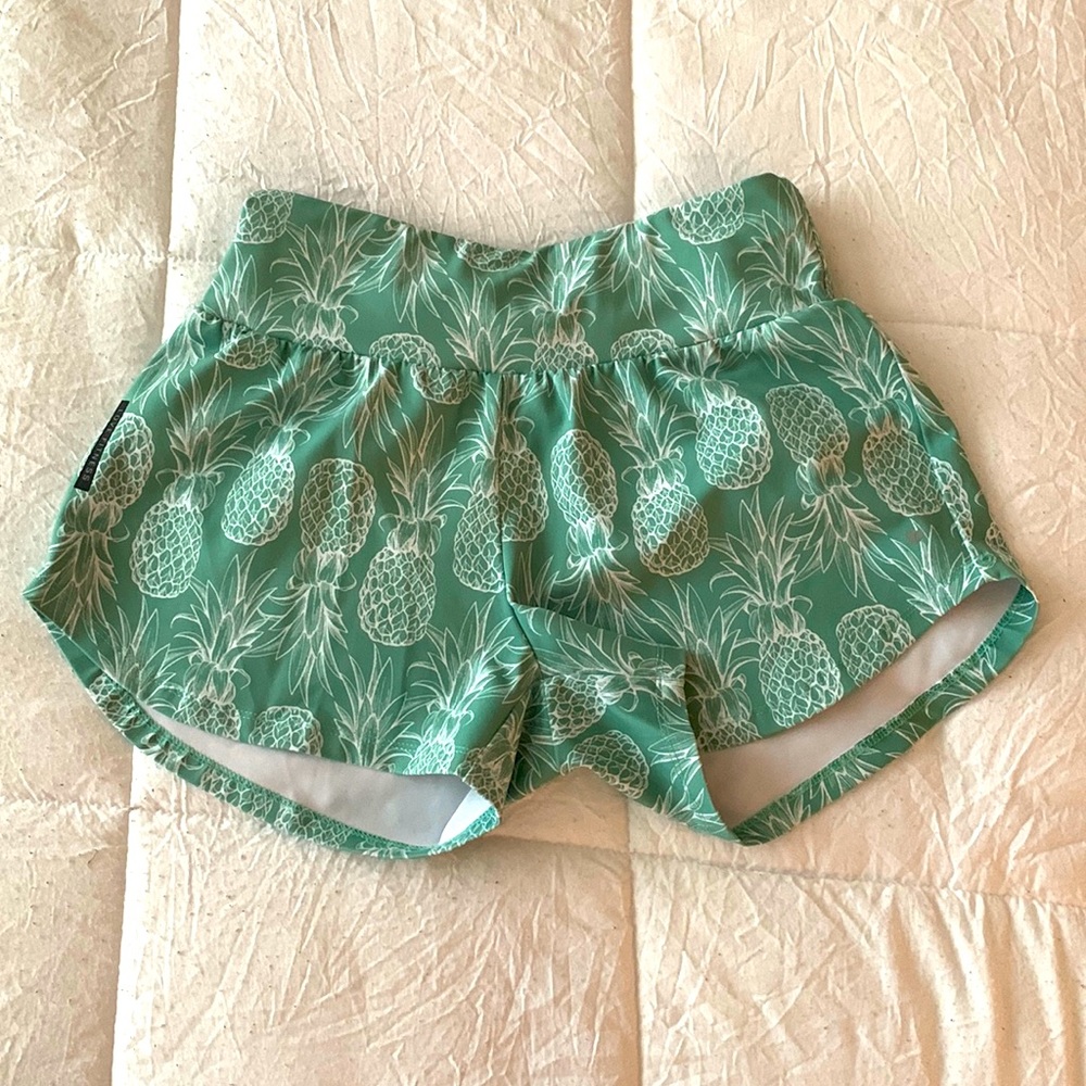 green pineapple running shorts